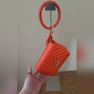 bebe Orange Quilted Wristlet